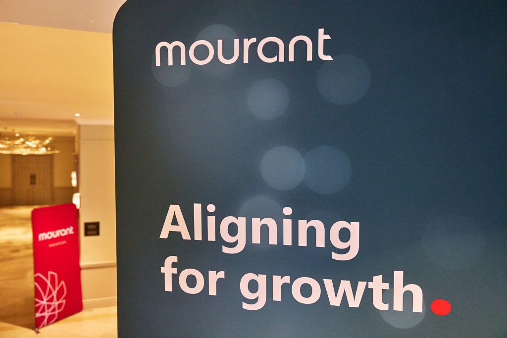 Mourant Aligning for growth branding board at an event